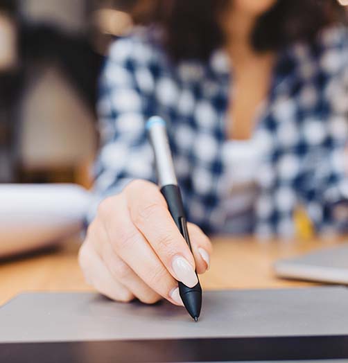 Close up of someone signing an important document, the moment DociShield governs from start to finish